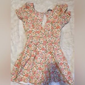 Floral print romper with V-cut and open back